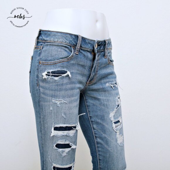 American Eagle Super Stretch Low Waist Distressed Raw Hem Jeggings - Picture 6 of 14